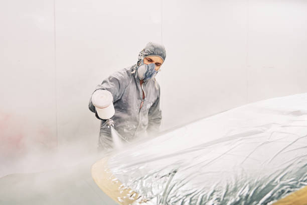 istock A man painting a car 1208883804