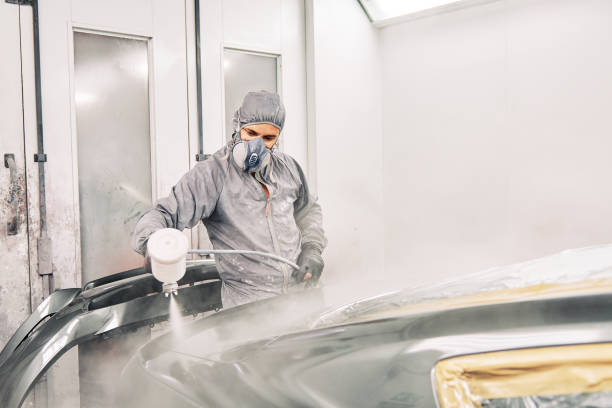 istock A man painting a car 1208883808