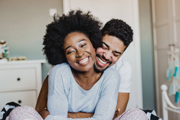 istock Young couple hugging in bed 1208883888