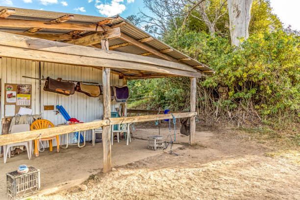 istock Old horse shed with pole to tie up horses 1208884280