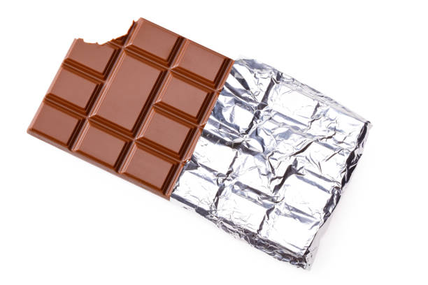 istock bitten milk chocolate bar in foil isolated on white background. top view 1208885367