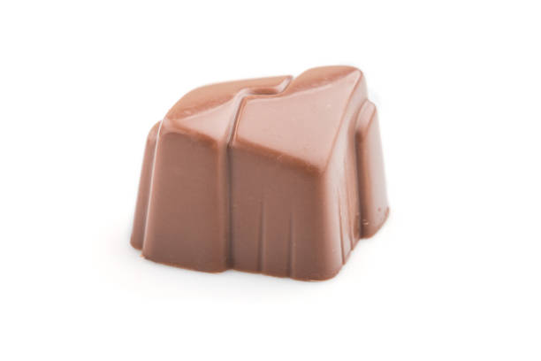 istock Single chocolate candy isolated on white background. side view, close up. 1208890868