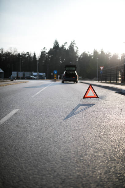 istock Young man calling for help because of a car accident. 1208891004