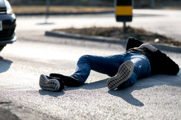 istock Traffic accident. Young man hit by a car 1208891137