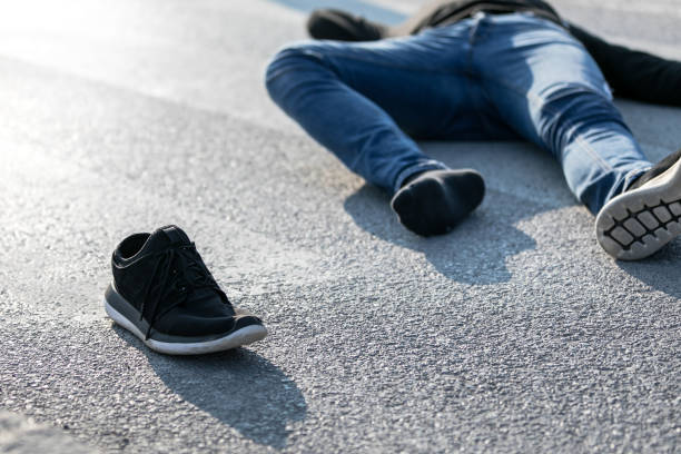 istock Traffic accident. Young man hit by a car 1208891214