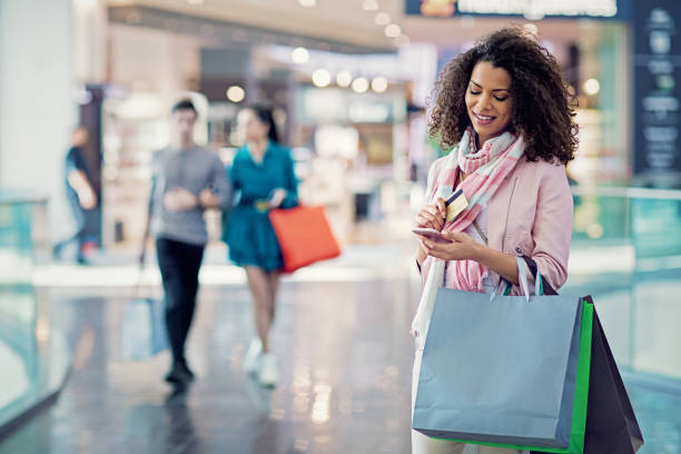 istock Shopping woman is texting in the Mall 1208891244