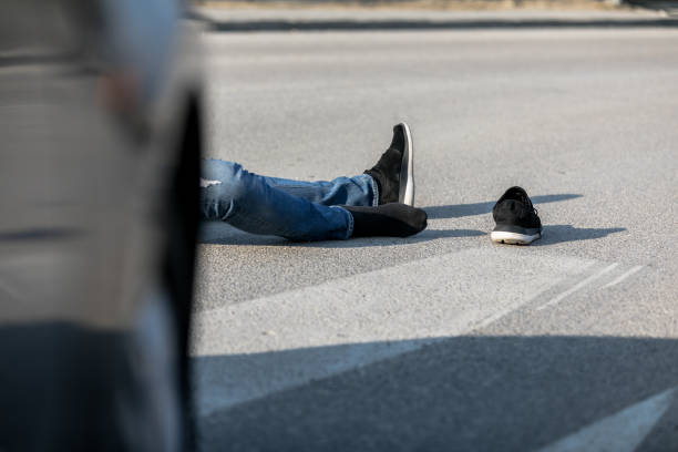 istock Traffic accident. Young man hit by a car 1208891282