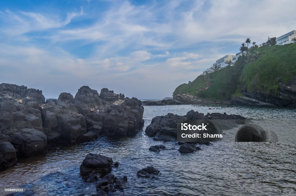 Pristine and natural Salt rock tidal pool in Dolphin coast Ballito Kwazulu Natal South Africa Pristine and natural Salt rock tidal pool in Dolphin coast Ballito Durban South Africa Animal Wildlife Stock Photo