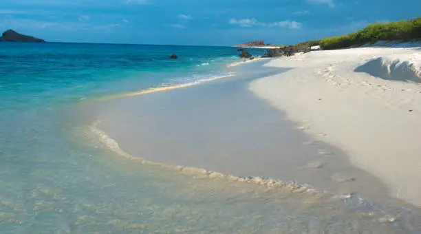 Photo of Deserted beaches with white sands and clear waters on Espanola Island, Galapagos Islands, Ecuador