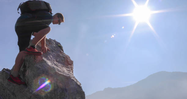istock Young man climbs up ridge in the mist and sunlight 1208898686