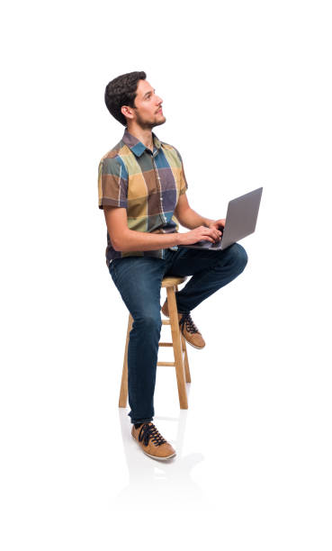 istock Young man holding laptop and looking up 1208904270