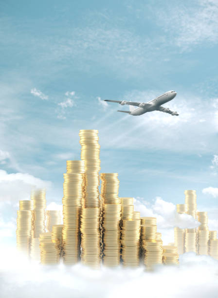istock Gold coins in form chart and airplane. 1208904271