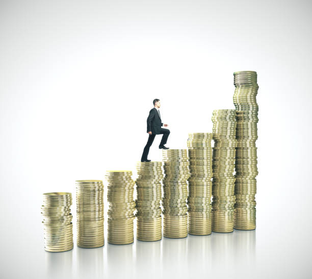 istock Businessman walking on gold coins 1208904323