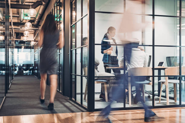 istock People walking in blurred motion in the office building 1208904461