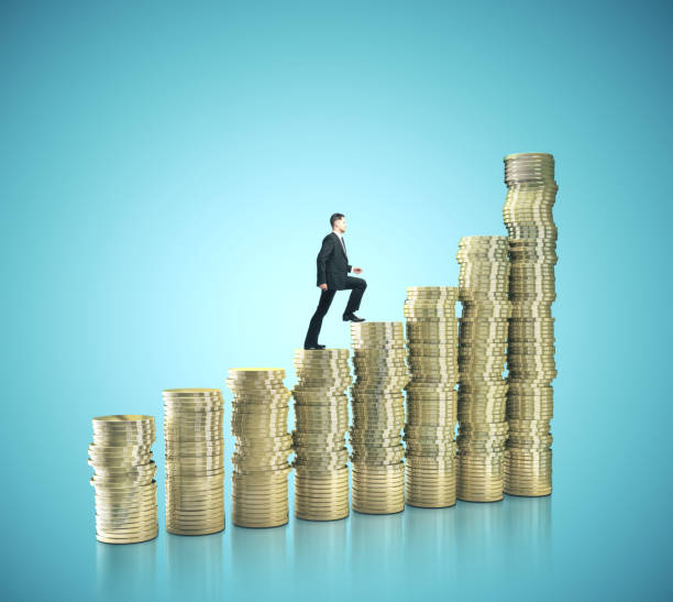 istock Businessman walking on gold coins 1208905139
