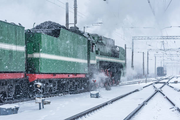 istock Retro steam train departs from the railway station. 1208906290
