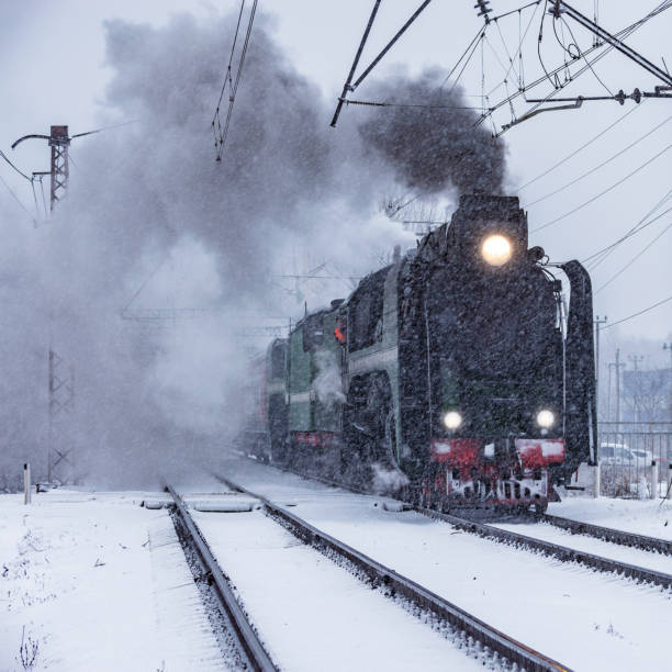 istock Retro steam train departs from the railway station. 1208906302
