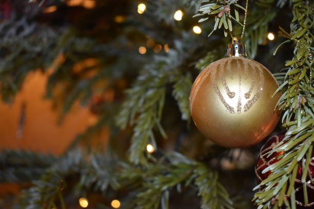 istock Golden ball decorated on Christmas tree, Christmas background 1208906821