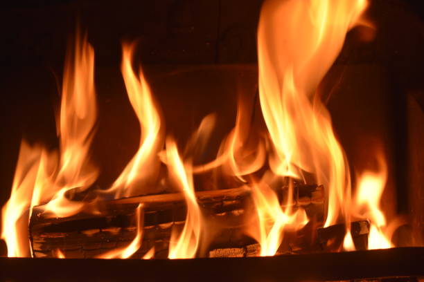 istock Dancing flames of a Festive log fire. 1208907130