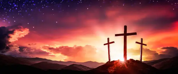 Three Wooden Crosses At Sunrise With Clouds And Starry Sky Background - Death And Resurrection Of Jesus Christ