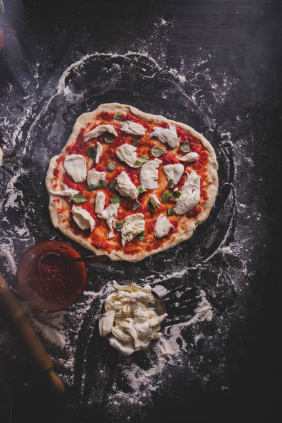 istock Making an Italian pizza at home 1208909028