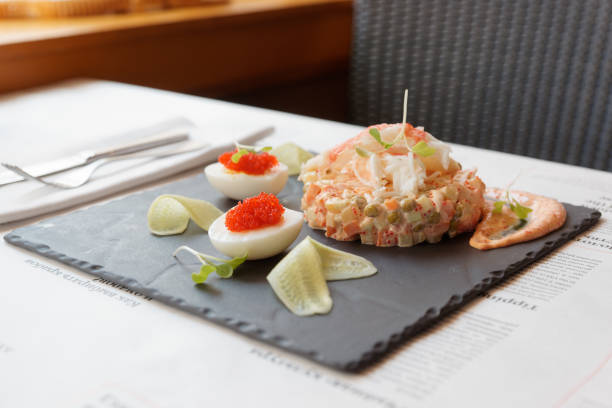 Russian salad with crab meat on restaurant table