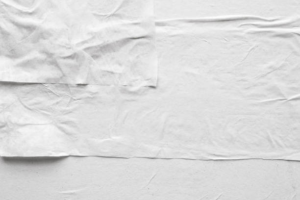 istock Blank white crumpled and creased paper poster texture background 1208910523