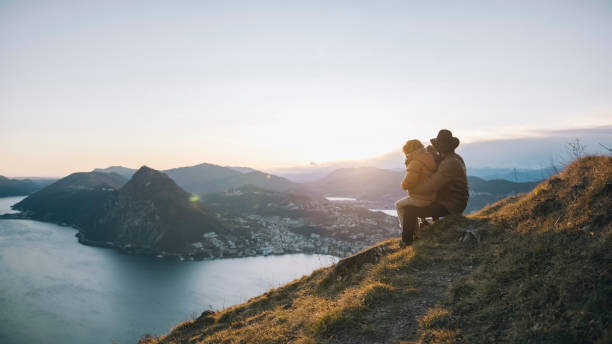 istock Father and son pause at edge of trail, mountainside 1208913764