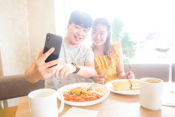 istock Lovely couple taking selfie together 1208914385