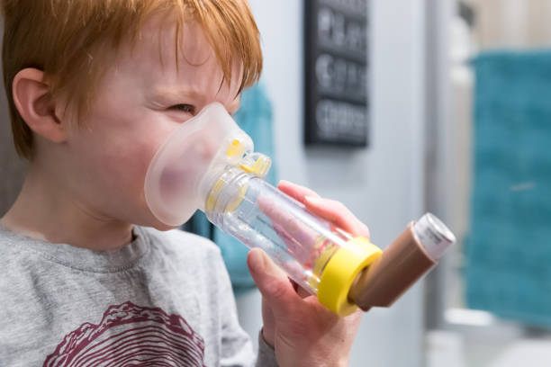 Woman using white asthma inhaler