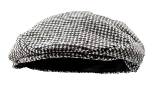 Floating grey hunting tweed flat cap or newsboy cap isolated on white background with clipping path cutout using ghost mannequin technique