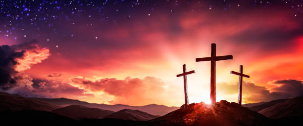 istock Three Wooden Crosses At Sunrise With Clouds And Starry Sky Background 1208926017