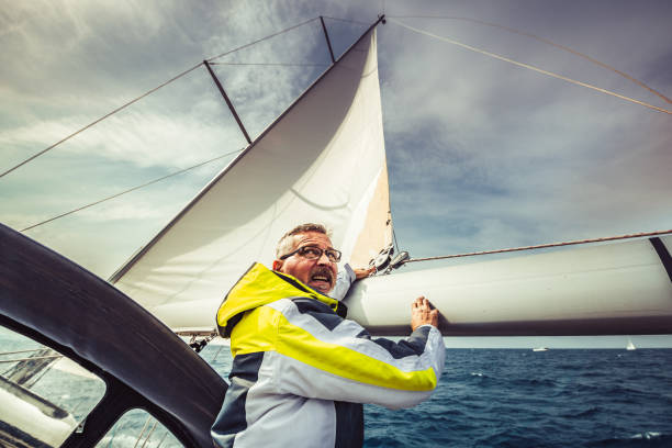 Adventure man on the sailing boat