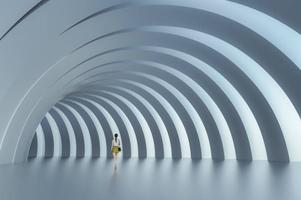 istock Empty urban passage with lonely woman walking 1208926516