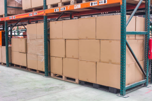 istock interior of warehouse. Rows of shelves with boxes 1208927581
