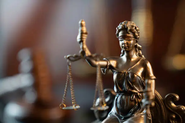 Law symbols composition: gavel, scale and Themis statue.