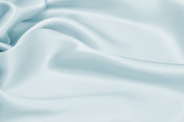 istock Delicate satin draped colored texture fabric for festive backgrounds 1208933610