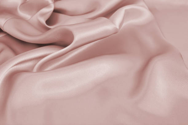 istock Delicate satin draped colored texture fabric for festive backgrounds 1208933612