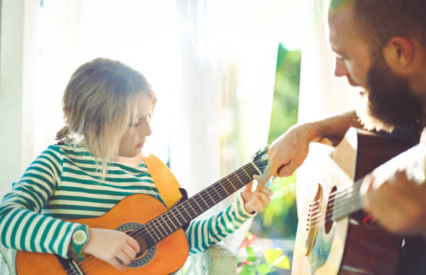 istock Jam session man and child play guitar 1208935893