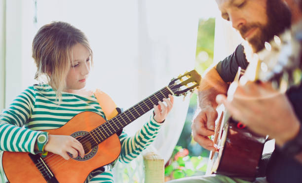 istock Jam session man and child play guitar 1208935908