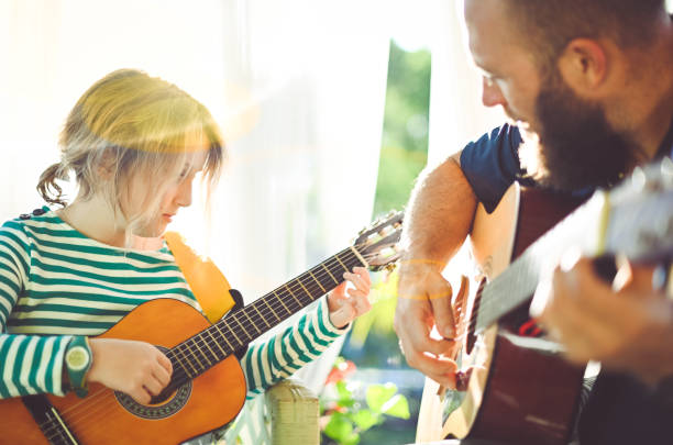 istock Jam session man and child play guitar 1208935965