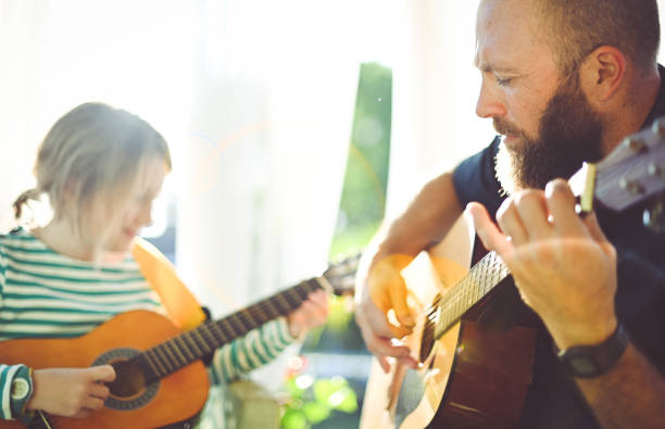 istock Jam session man and child play guitar 1208936026