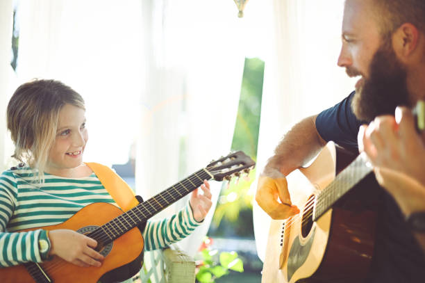 istock Jam session man and child play guitar 1208936067