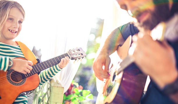 istock Jam session man and child play guitar 1208936114
