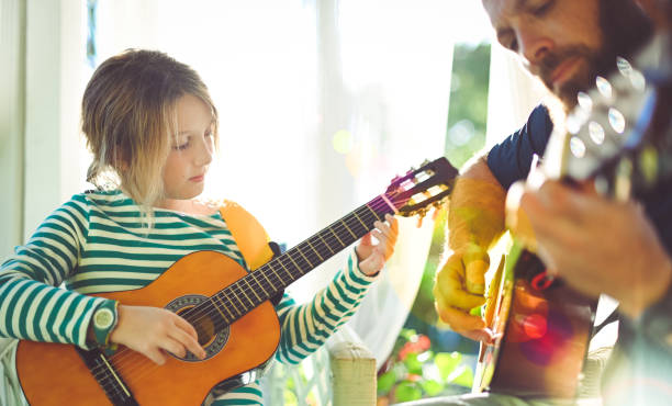 istock Jam session man and child play guitar 1208936126
