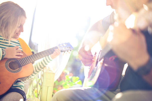 istock Jam session man and child play guitar 1208936643