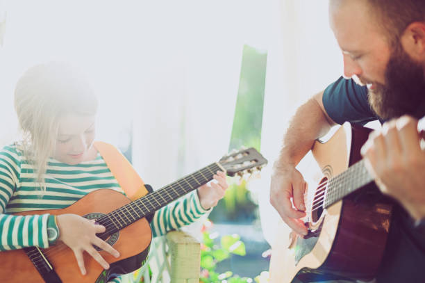 istock Jam session man and child play guitar 1208936652