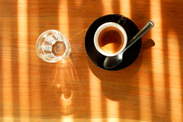 istock Espresso Hot coffee with Sunlight in coffee shop. 1208940814