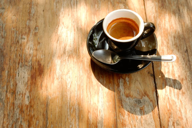 istock Espresso Hot coffee with Sunlight in coffee shop. 1208940817