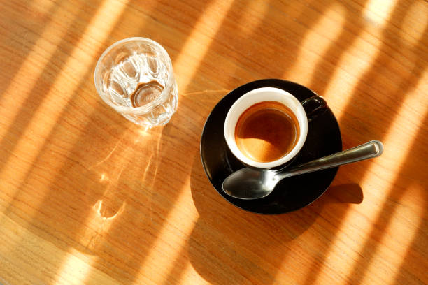 istock Espresso Hot coffee with Sunlight in coffee shop. 1208940823